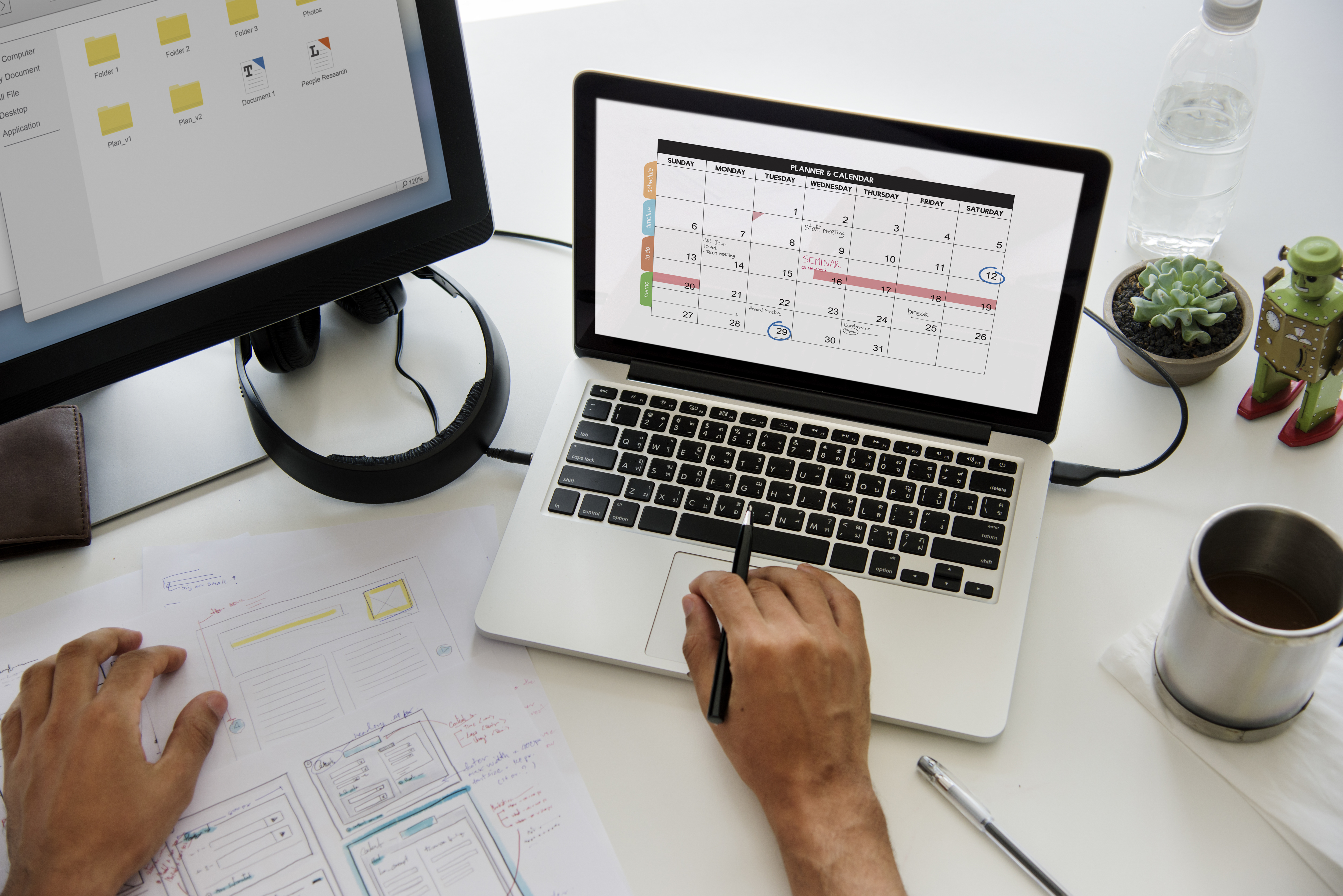 Productivity: person planning tasks on a laptop with a digital calendar